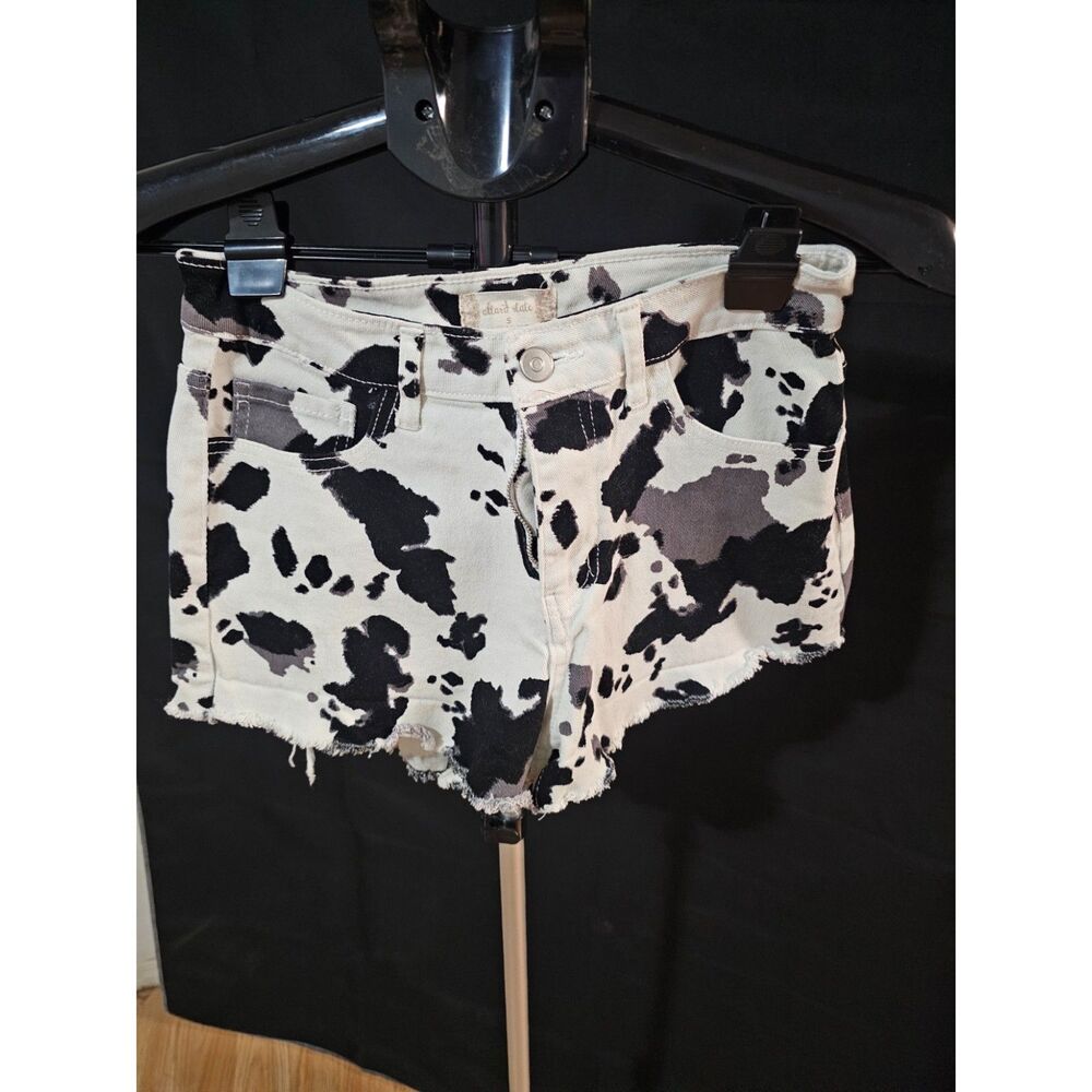 Altar'd State Cow Print High-Waisted Raw Hem Denim Shorts (Size S)